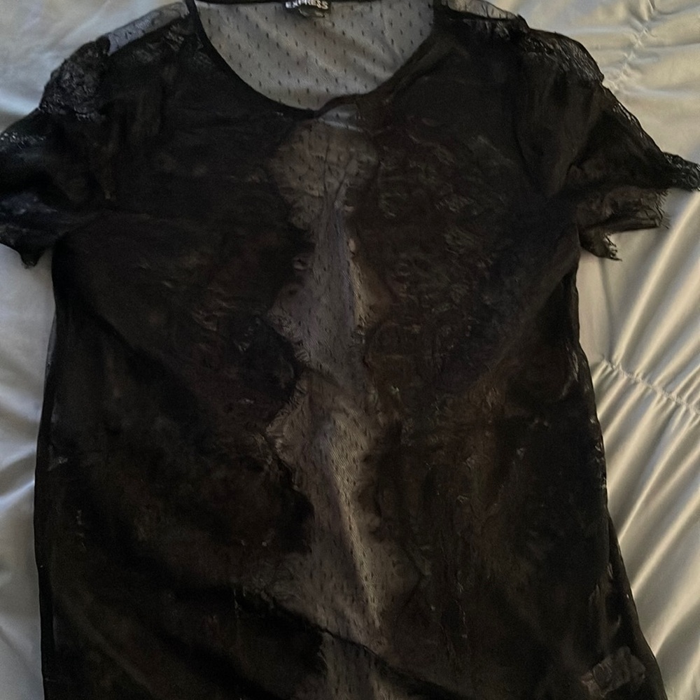 This is a black lace see-through shirt from express. There are no rips